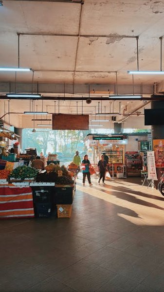 A detailed wrought-iron caricature explaining local history on a George Town street corner